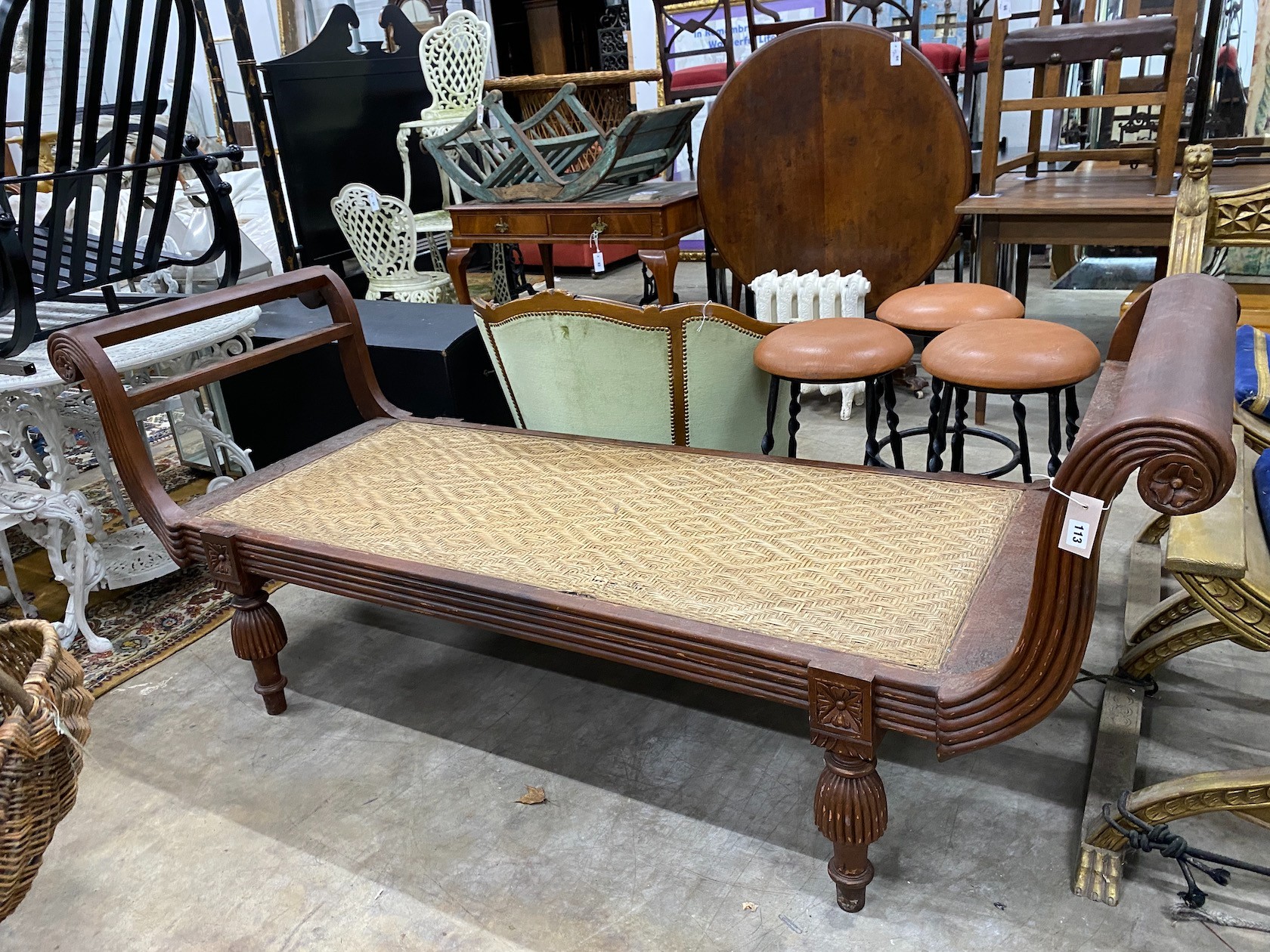 An Indonesian caned hardwood daybed, length 212cm, depth 71cm, height 84cm